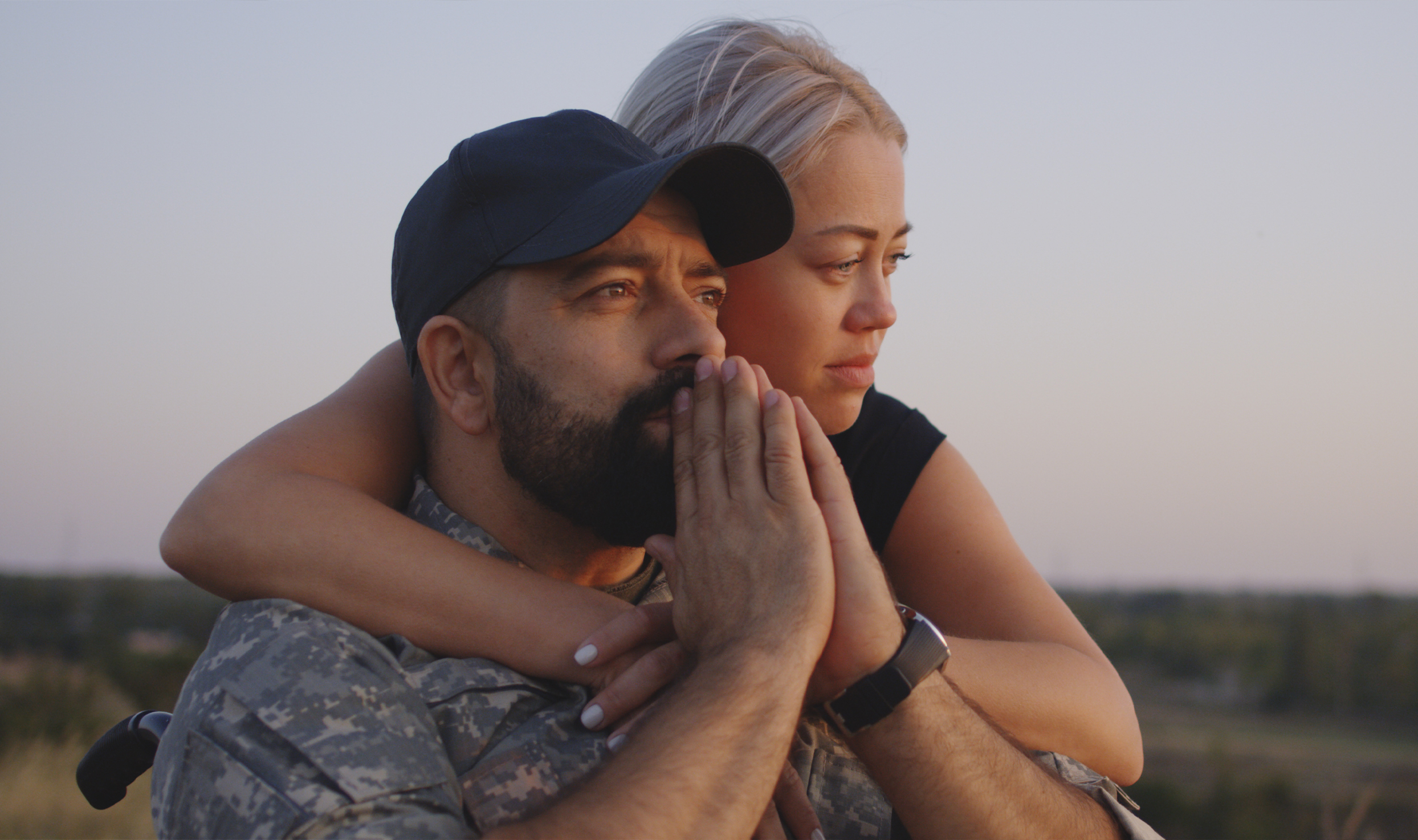 Couple pictured together embracing each other.