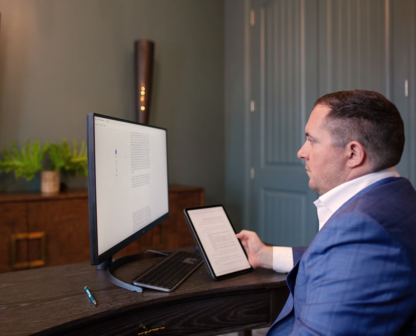 Attorney Chris Kinon sitting in front of a computer